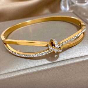 Elegant Gold Knot Bangle with Crystals